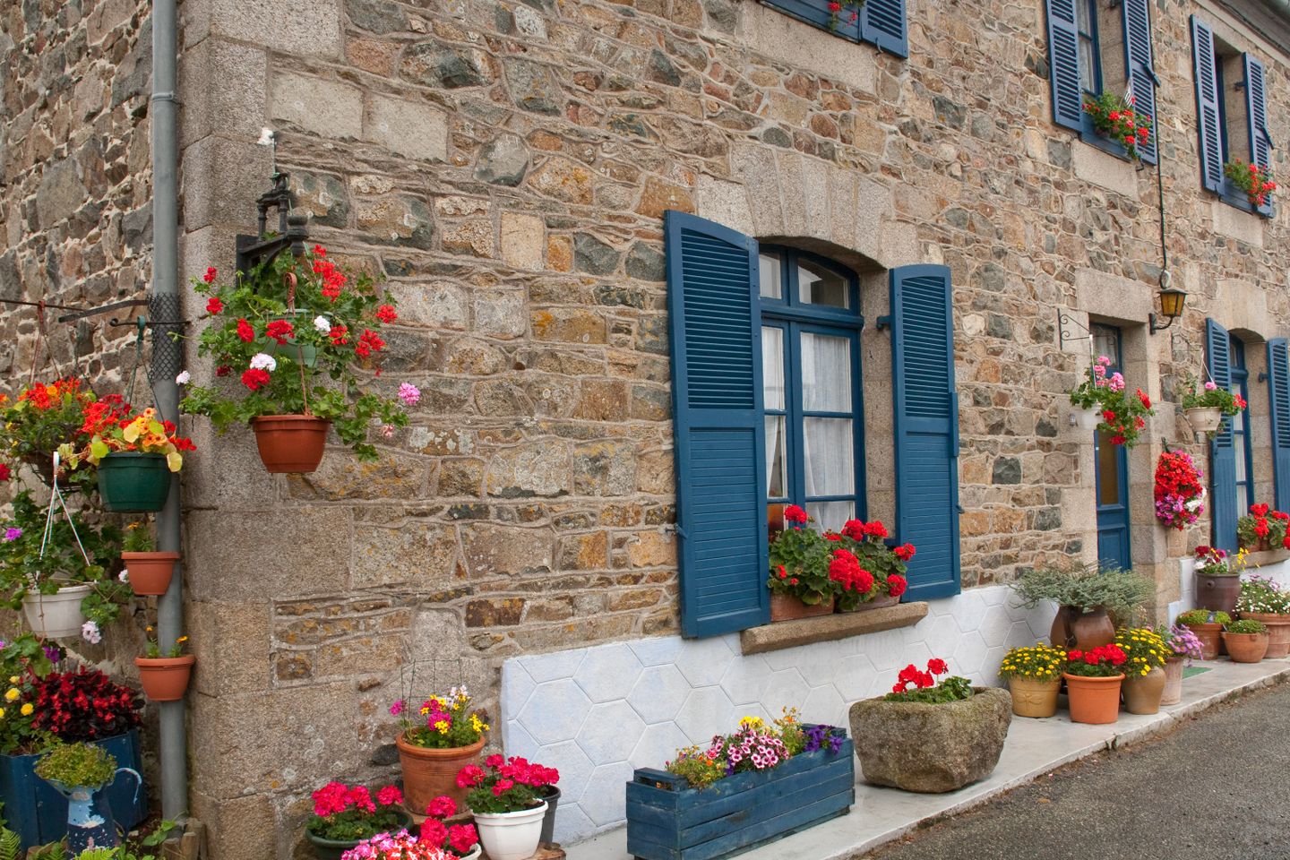 Helpful tips for visiting Paris - from a local Flowers decorating a street in Normandy, France.